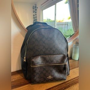 Large black and brown Coach backpack
